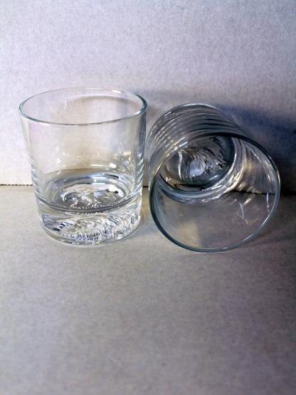 Whiskey Glass Set Of 2 - (2) 10.6oz thick bottom whiskey glasses, each with the head of a majestic American bald eagle etched into the bottom