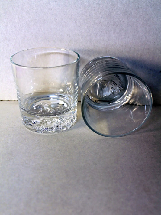 Whiskey Glass Set Of 2 - (2) 10.6oz thick bottom whiskey glasses, each with the head of a majestic American bald eagle etched into the bottom